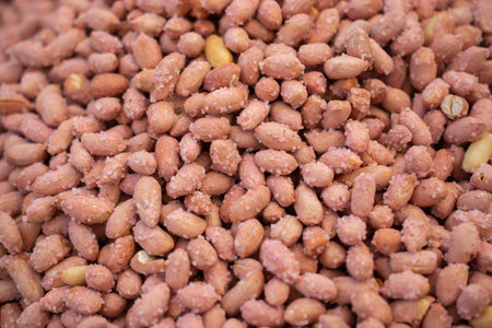 Unshelled peanuts in abundance for snack food in viewの写真素材