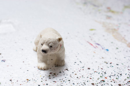 Polar bear figurine on white background, closeup. Space for textの写真素材