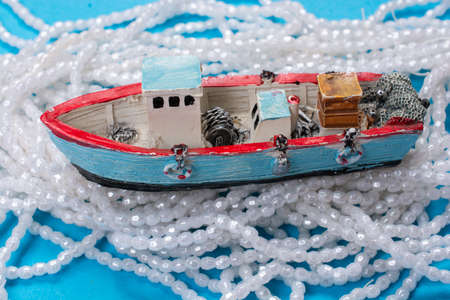 Model of Old Sail Boat Placed Over Pink Background. Horizontal Shot
