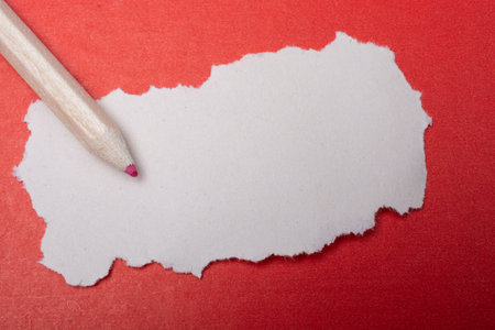 wooden pencil and torn note paper for text or messageの写真素材