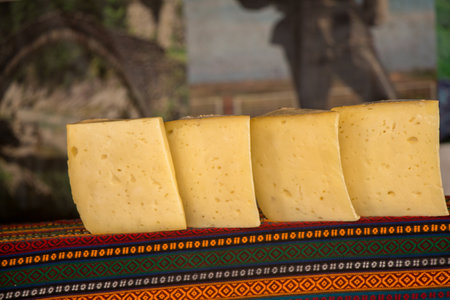 cuts of kashkaval or kasseri  cheese for sale on the shelf