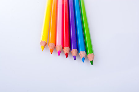 Color Pencils of Various colors placed on white backgroundの写真素材