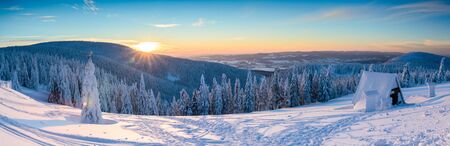 Polish Winter landscape in the mountains, snowy trees and roadsの写真素材