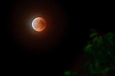Poland, The total eclipse of the moon, the bloody moon at night.