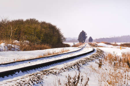 Railroad tracks in snow, winter landscape.の写真素材