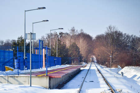 The train is approaching the train station on a winter day.の写真素材