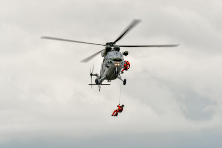 Ostrava, Czech Republic - September, 18, 2021: Helicopter W-3A SOKOL of Czech Helicopter W-3A SOKOL of Czech Air Force during NATO Days 2021 show in Ostrava with rescue crew roping up.のeditorial素材