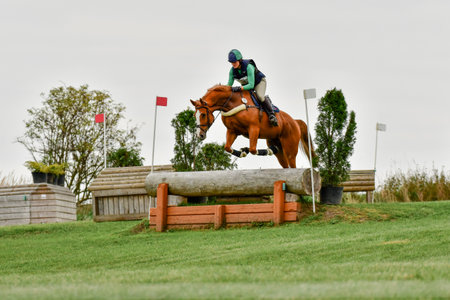 Strzegom October Festival, Morawa, Poland - October, 17, 2021: German competitor Vanessa Bolting on horse Cunterbunt 5 jumps through the station during the competition.のeditorial素材
