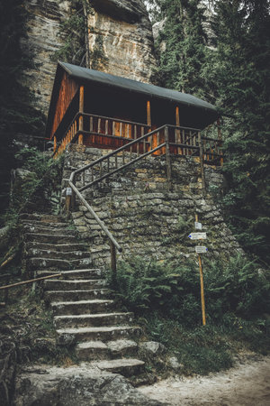 Teplicke Skaly, a rock town in the Czech Republic, an educational path through a sandstone labyrinth, a wooden shelter on the trail.の写真素材