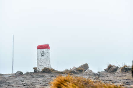 Border mark on the border of the Polish-Czech state, the post stands along the hiking trail on a...