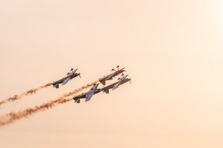 Leszno, Poland - June, 17, 2022: Antidotum Airshow Leszno, The Flying Bulls XtremeAir Sbach 342, Aerobatic Team. Airplane pilots perform acrobatics in the air demonstrating their skills at sunset.のeditorial素材