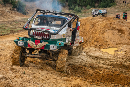 Kunstat, Czech Republic - August 14, 2022: Unidentified truck at difficult muddy terrain during truck trial National championship show of Czech Republic 2022 in Kunstat.のeditorial素材