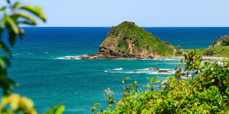 Australian coast, view from a cliff of the blue ocean and a rocky shore with a sandy beach. Small...