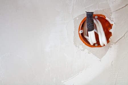 Wall power socket mounted on a plasterboard wallの写真素材