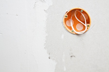 Wall power socket mounted on a plasterboard wallの写真素材