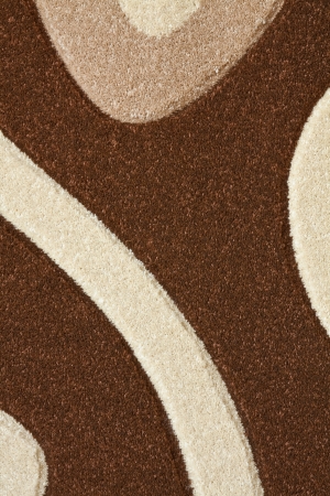 Detail of the carpet in brown, beige and white pastel colors in abstract curvesの写真素材