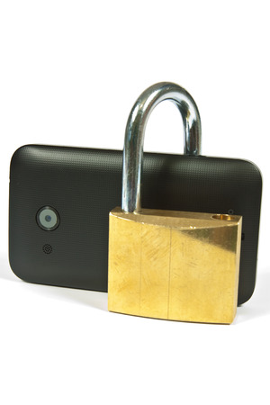 Cell phone beside it a large metal padlockの写真素材