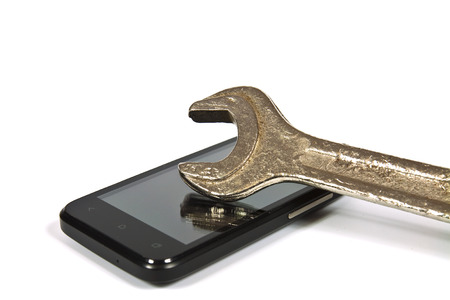 Wrench put on display on a cell phoneの写真素材