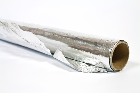 Roll of household aluminum foil on white backgroundの写真素材