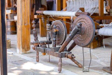 Old wooden appliances for manual winding of yarn. Selective focus with shallow depth of field.の写真素材