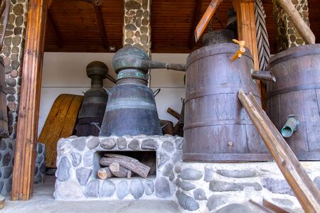 An old device for distilling and extracting oil from rose flowers. Selective focus with shallow...