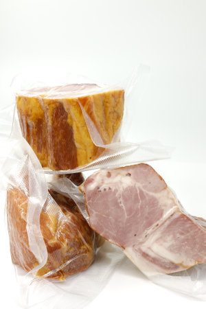 Smoked pork in vacuum packaging. Selective focus with shallow depth of field.の写真素材