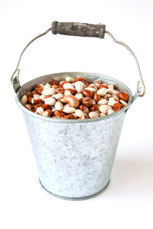 Colorful ripe beans in a metal bucket. Selective focus with shallow depth of field.