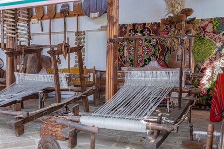 Old wooden loom for weaving carpets. Selective focus with shallow depth of field.