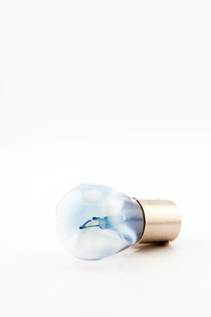 Car light bulb with filament for tail, brake and indicator lights. Selective focus with shallow depth of field.の写真素材