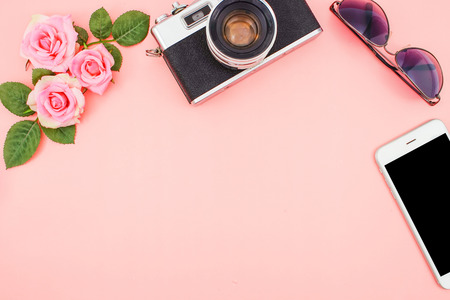 Vintage Camera, Sunglasses and Mobile Phone on Pink Rose Background, Flat Lay Style with Free Text Space, Travel Plan and Vacation Conceptの写真素材