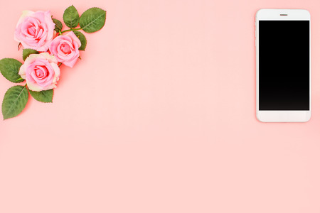 Mobile Phone on Pink Rose Vintage Background, Flat Lay Style with Free Text Spaceの写真素材