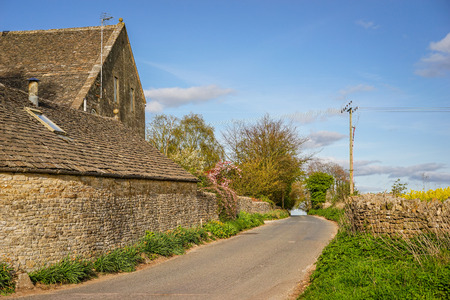 Small Road in The Village of Bisley, Stroud, Gloucestershire, Englandの写真素材