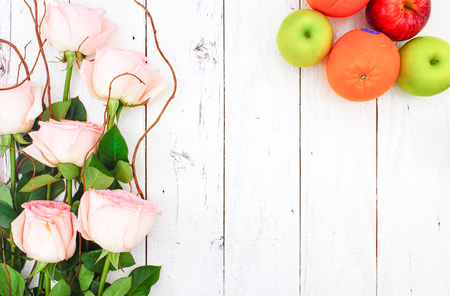 Diet concept on Vintage White Wooden Background with Pink Rose Bouquet, Flat Lay Styleの写真素材