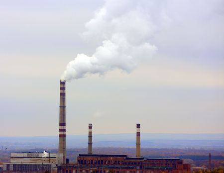 Smoke from the pipes of factory. Gloomy formの写真素材