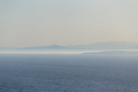 Sea and mountains in the fog on the Mediterranean sea in Cyprusの写真素材
