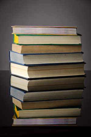 Pile of books on black background. Back to school concept.の写真素材