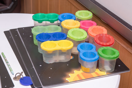 Plastic containers for food on the table in a children's roomの写真素材
