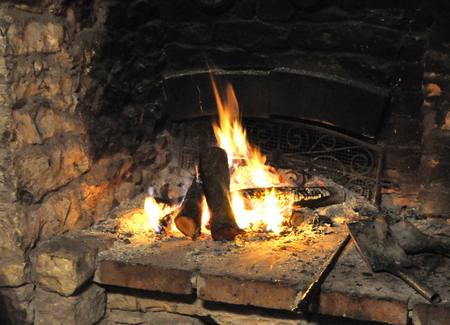 Fire in the historic fireplaceの写真素材