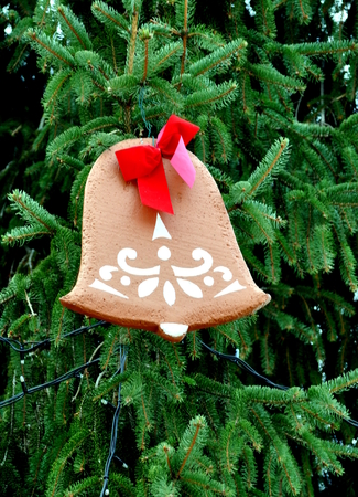Gingerbread heart on a Christmas treeの写真素材