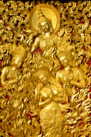 golden warehouse in Wat Xieng Thong Buddhist temple in Luang Prabang Laoの写真素材