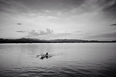Fishing at the sea in black and whiteの素材