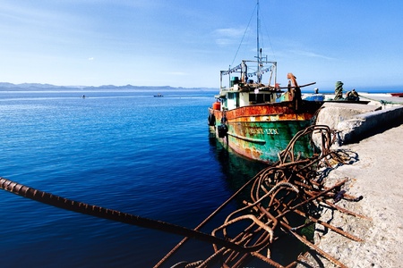 Old fishing boat at the pierの素材