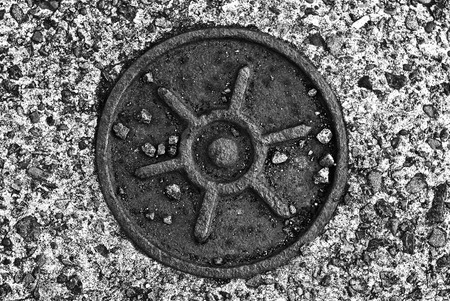 A manhole with sun symbol at Tokyo central park.の写真素材