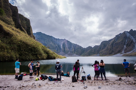 Friends enjoying the majestic view of Mt. Pinatubo crater lake after a long trek. Circa 2016のeditorial素材