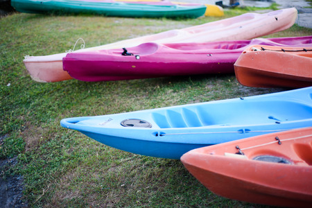 Colorful plastic boat at the lake side.の写真素材
