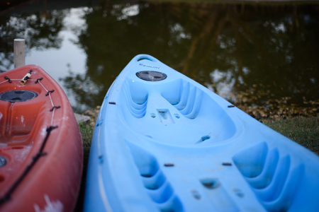 Colorful plastic boat at the lake side.の写真素材