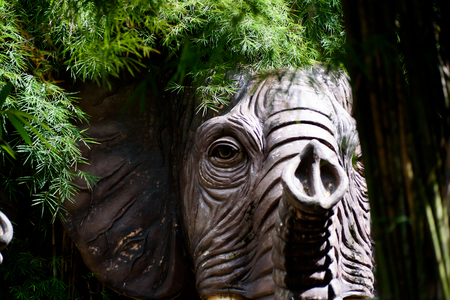 Elephant head sculpture in the garden.の写真素材