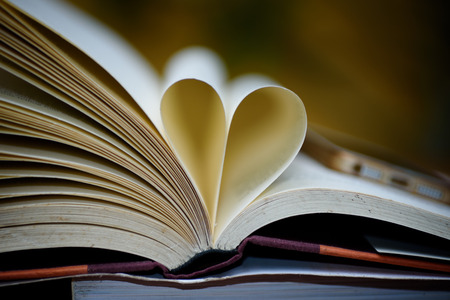 Open book  with heart shape page.の写真素材