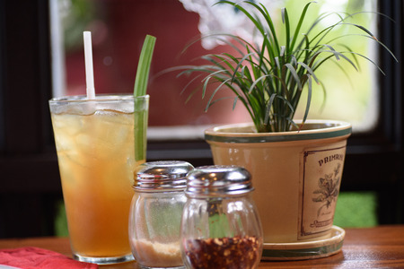 A glass of drink on the table.の写真素材