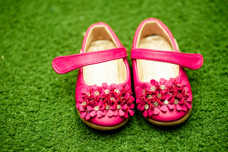 Kids pair of pink shoes.の写真素材